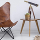 Amerihome’s Leather Butterfly Chair takes that cheap dorm room staple, and updates it for adult tastes.